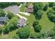 An aerial view showcases this lovely home with its large yard and mature trees at 11030 Brentwood Ave, Zionsville, IN 46077