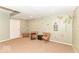 Finished basement with decorative wall art, plush carpeting, and comfortable seating area at 11030 Brentwood Ave, Zionsville, IN 46077