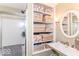 Tidy bathroom with glass enclosed shower and shelving, maximizing storage capacity at 11030 Brentwood Ave, Zionsville, IN 46077