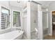 Bathroom featuring a free standing tub and separate glass enclosed shower at 11030 Brentwood Ave, Zionsville, IN 46077