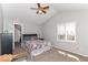 Sun-filled bedroom with vaulted ceilings, a ceiling fan, and plush carpeted floors at 11030 Brentwood Ave, Zionsville, IN 46077