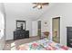 Light filled bedroom boasts vaulted ceilings and comfortable furniture, perfect for relaxation at 11030 Brentwood Ave, Zionsville, IN 46077