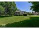 Beautiful home with well-manicured lawn and mature trees surrounding the property at 11030 Brentwood Ave, Zionsville, IN 46077
