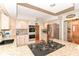 Well-appointed kitchen with stainless steel appliances, granite countertops, and access to dining and living areas at 11030 Brentwood Ave, Zionsville, IN 46077