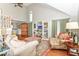 Comfortable living room with tall ceilings, hardwood flooring, and a large arched window for natural light at 11030 Brentwood Ave, Zionsville, IN 46077