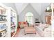 Inviting living room showcases a large arched window, tall ceilings, and a well-lit atmosphere at 11030 Brentwood Ave, Zionsville, IN 46077