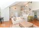Bright and airy living room with hardwood floors, tall ceilings, and an elegant staircase at 11030 Brentwood Ave, Zionsville, IN 46077