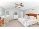Primary bedroom featuring vaulted ceiling, neutral paint, carpeting, ceiling fan, and windows with blinds at 11030 Brentwood Ave, Zionsville, IN 46077