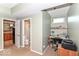 Functional office space with ample desk space and view into an attached bathroom at 11030 Brentwood Ave, Zionsville, IN 46077
