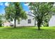 Expansive backyard featuring lush green lawn and mature trees at 11518 Cherry Blossom W Dr, Fishers, IN 46038