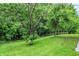 Spacious backyard offering privacy and mature trees at 11518 Cherry Blossom W Dr, Fishers, IN 46038