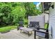 Serene backyard patio with stylish furniture, string lights, and a privacy fence for intimate gatherings at 11518 Cherry Blossom W Dr, Fishers, IN 46038