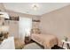 Cozy bedroom with pink walls, a twin bed, shelving, and decor at 11518 Cherry Blossom W Dr, Fishers, IN 46038