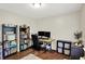 Functional bedroom setup, perfect for study or relaxation, with desk and shelving at 11518 Cherry Blossom W Dr, Fishers, IN 46038