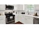 The kitchen has stainless steel appliances, white subway tile, and shaker cabinets at 11518 Cherry Blossom W Dr, Fishers, IN 46038