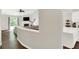 Open concept living room with hardwood floors and a view of the kitchen at 11518 Cherry Blossom W Dr, Fishers, IN 46038