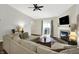 Cozy living room features a fireplace, ceiling fan, and sliding glass doors to the outdoor area at 11518 Cherry Blossom W Dr, Fishers, IN 46038