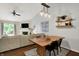 Open-concept area with dining table, living room, fireplace and flat-screen TV at 11518 Cherry Blossom W Dr, Fishers, IN 46038