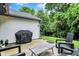 Cozy patio area complete with seating, a grill, and string lights, ideal for relaxing outdoors at 11518 Cherry Blossom W Dr, Fishers, IN 46038