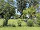 Expansive backyard featuring mature trees, lush greenery, and a 'Private Property' sign for added privacy at 1206 Lincoln St, Shelbyville, IN 46176