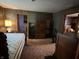 Bedroom with wood paneling, closet, and a ceiling fan at 1206 Lincoln St, Shelbyville, IN 46176