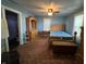 Comfortable bedroom with vintage furniture, ceiling fan, and natural light at 1206 Lincoln St, Shelbyville, IN 46176