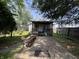 Charming front yard with a covered porch, bench, and ample green space for outdoor enjoyment at 1206 Lincoln St, Shelbyville, IN 46176