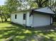 Detached garage with a white door and a side door for easy access at 1206 Lincoln St, Shelbyville, IN 46176