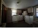 The functional laundry room features abundant cabinet space, essential appliances, and a practical design at 1206 Lincoln St, Shelbyville, IN 46176