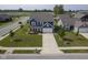 Aerial view of a two-story home with an attached garage and a well-manicured lawn at 1278 W Limestone Way, Fortville, IN 46040