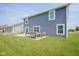 Large backyard with a patio and lush green grass at 1278 W Limestone Way, Fortville, IN 46040