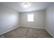 Neutral bedroom with carpet, window, and white trim. Simple and cozy for relaxation at 1278 W Limestone Way, Fortville, IN 46040