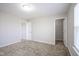 Neutral bedroom featuring carpet, white trim, and a closet with a shelf, illuminated by overhead lighting at 1278 W Limestone Way, Fortville, IN 46040