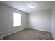 Bedroom featuring neutral carpet and a window at 1278 W Limestone Way, Fortville, IN 46040