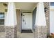 Covered front door framed by brick columns at 1278 W Limestone Way, Fortville, IN 46040