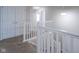 Bright hallway featuring neutral walls, carpet, white trim, doors, and a staircase with natural light at 1278 W Limestone Way, Fortville, IN 46040