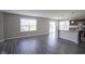 Open living area featuring hard surface flooring, large window and view of the kitchen with breakfast bar at 1278 W Limestone Way, Fortville, IN 46040