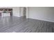 Bright living room showing stairs, open concept kitchen and hard surface flooring in the common area at 1278 W Limestone Way, Fortville, IN 46040