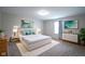 Stylishly furnished main bedroom featuring serene decor, plush bedding, and ample natural light at 1278 W Limestone Way, Fortville, IN 46040