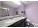 Lilac bathroom featuring double sinks, granite countertops, and tile flooring at 1312 Donald Pass, Greenwood, IN 46143