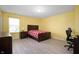 Bright bedroom with yellow walls featuring stylish flooring, bed, and furnishings at 1312 Donald Pass, Greenwood, IN 46143