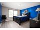 This bedroom features a large bed, two-tone walls, a bright window and modern flooring at 1312 Donald Pass, Greenwood, IN 46143