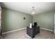 Bright bedroom/office featuring modern lighting, light walls, and a functional workstation at 1312 Donald Pass, Greenwood, IN 46143