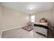 Bright, minimalist bedroom with hardwood floors, a statement rug, and sleek, mirrored bedside tables at 1312 Donald Pass, Greenwood, IN 46143