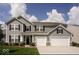 Charming two-story home features a well-maintained lawn and a two-car garage at 1312 Donald Pass, Greenwood, IN 46143