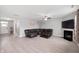 Open concept living room with recessed lighting, hardwood floors, fireplace and a comfy sectional at 1312 Donald Pass, Greenwood, IN 46143