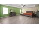 Spacious main bedroom suite with hardwood floors, tray ceilings, and and furniture at 1312 Donald Pass, Greenwood, IN 46143