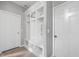 Hallway featuring a mudroom with custom storage, seating, and neutral paint at 1312 Donald Pass, Greenwood, IN 46143