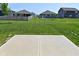 Spacious backyard with lush lawn and a concrete patio at 1351 Byron St, Greenfield, IN 46140