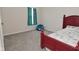 Cozy bedroom with a red bed frame, window, carpet, and themed beanbag at 1351 Byron St, Greenfield, IN 46140